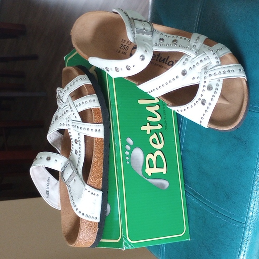 Never worn in original box white studded leather Betula.